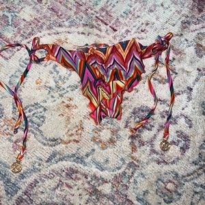 Luli Fama size small string bikini cheeky bottom